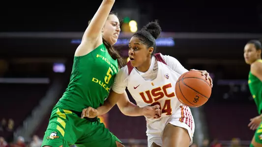 Desiree Caldwell drives baseline vs. an Oregon defender