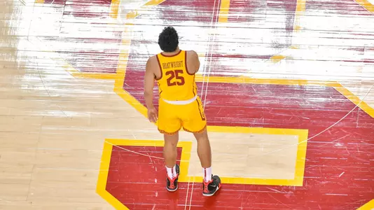 Bennie Boatwright standing on USC logo