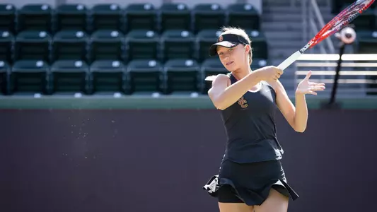 Danielle Willson follows through on a forehand swing.