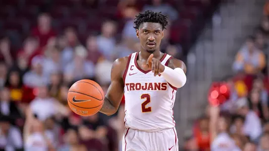 Jonah Mathews dribbling and pointing