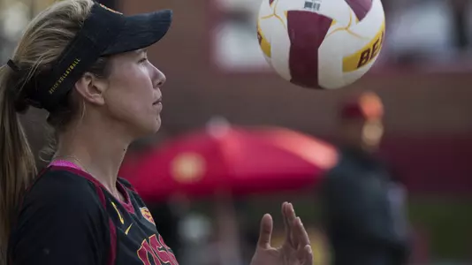 USC beach volleyball senior Abril Bustamante tosses a ball before serving