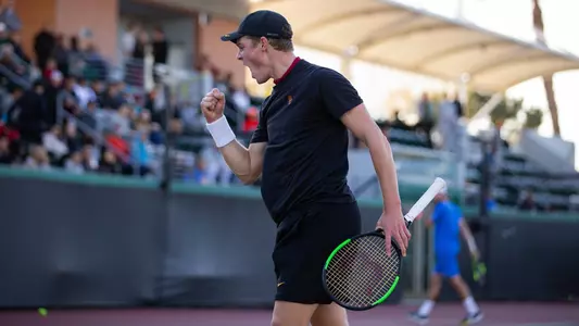 Laurens Verboven cheers a point won in a match vs. UCLA