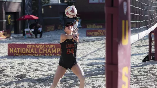 Beach volleyball junior Cammie Dorn bumps the ball