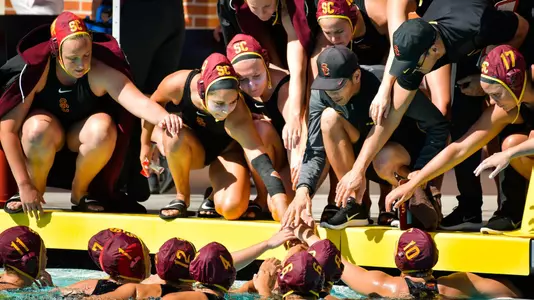 Team huddle at a timeout at Uytengsu