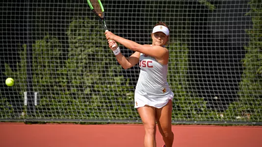 Ana Neffa follows through on a double forehand.