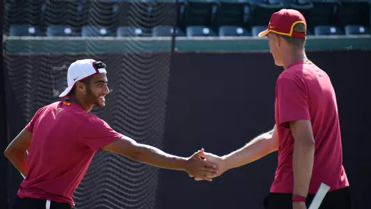 Doubles team Daniel Cukierman and Tanner Smith congratulate each other on a point won.
