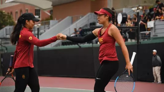 Angela Kulikov/Rianna Valdes fist bump after winning a point.