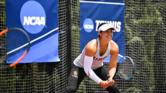 Angela Kulikov smiles as she scores in the NCAA Tournament.