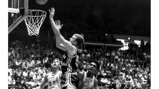 USC Trojans forward Jim Marsh shoots over UCLA Bruins center Lew Alcindor