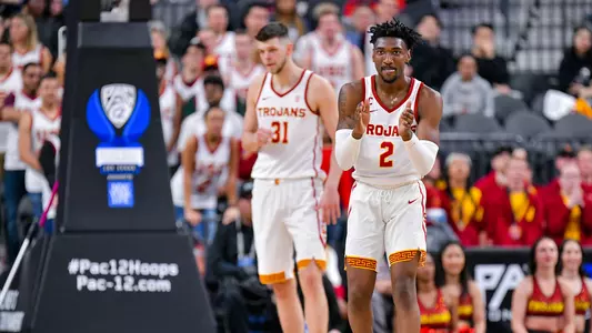 USC Trojans Basketball's Jonah Mathews and Nick Rakocevic celebrate at Pac-12 Tournament