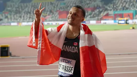 Andre De Grasse flashes Fight On! at IAAF Worlds