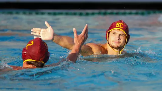 Jacob Mercep gives five to teammate Sam Slobodien