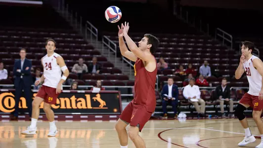 Cole Paxson overhead passes the ball from the back row.