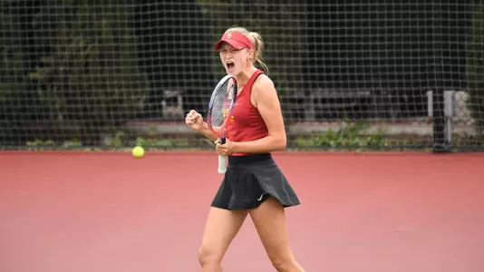Danielle Willson fist pumps and celebrates a win.