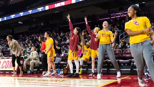 The bench cheers a 3-pointer made in USC's OT win over Washington