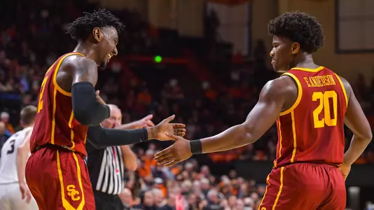 Jonah Mathews and Ethan Anderson slap hands