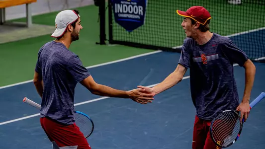 Mor Bulis and Ryder Jackson celebrate a point one in an ITA Indoor match win vs. Stanford