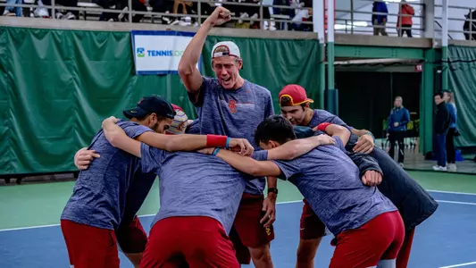 The USC team gathers up in a huddle at ITA National Team Indoors in Madison, Wisc.