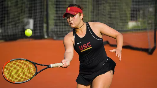 Ana Neffa follows through on a forehand shot.