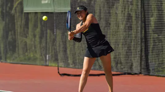 Angela Kulikov follows through on a double-handed forehand.