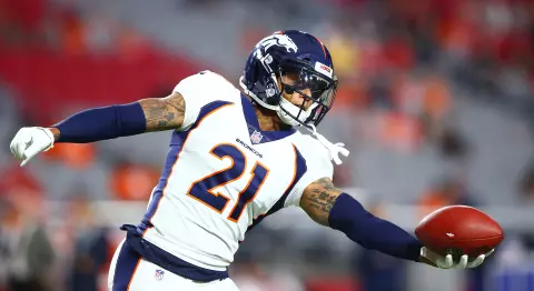 Su'a Cravens catching a ball wearing Broncos uniform