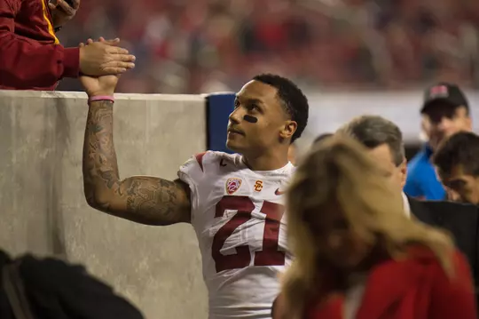 su'a Cravens shaking hands with a fan