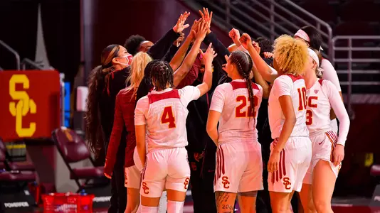 The USC women huddle up for a cheer before a game at Galen Center