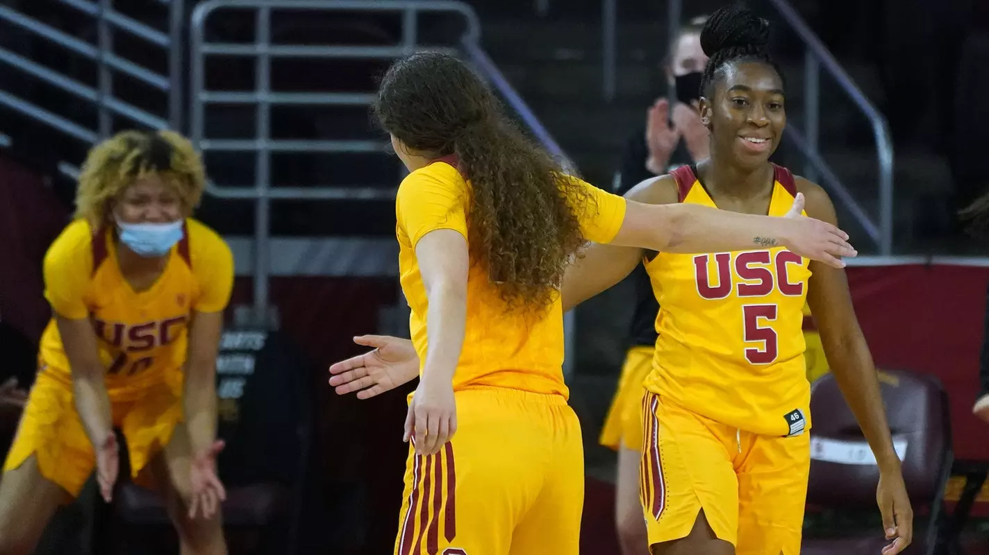 Kyra White & Jordan Sanders give each. other five in USC's overtime win over WSU at Galen Center