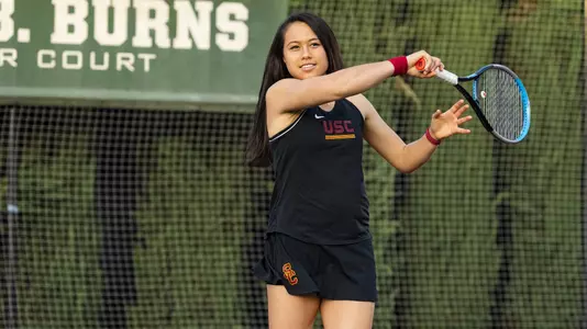 Angela Kulikov follows through on a forehand swing.