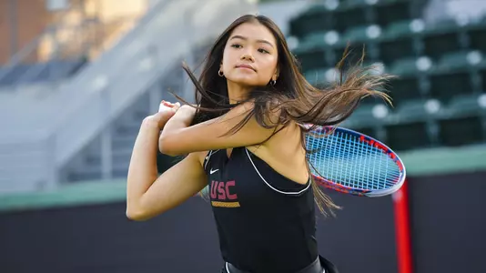 Naomi Cheong follows through on a backhand swing