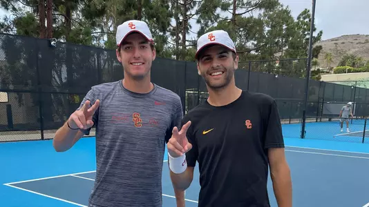 Samuel Rubell and Stefan Dostanic smile after a win at at the 2021 ITA Southwest Regional