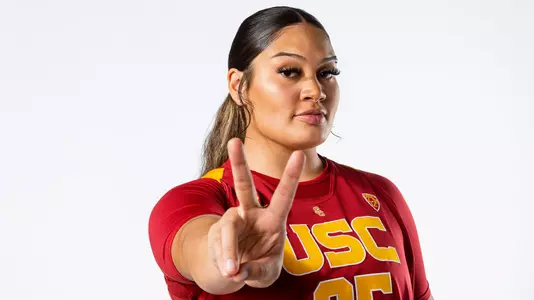 Alissa Pili flashes a fight on to the camera during a photo shoot
