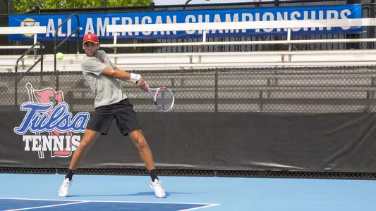 Stefan Dostanic hits a backhand during the ITA All-American doubles semifinals in Tulsa