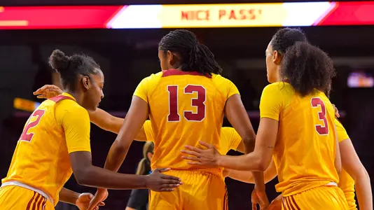 Teammates congratulate Rayah Marshall on a nice play during a game at Galen Center