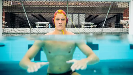 Goalie Nic Porter stares down the camera from in front of the cage in a photo shoot  at Uytengsu