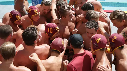 USC players and coaches huddle up before a game at Uytengsu Aquatics Center