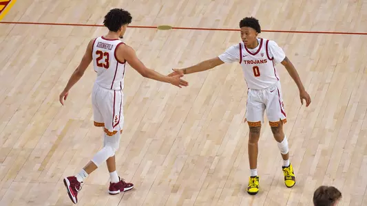 USC Trojans Basketball Boogie Ellis and Max Agbonkpolo celebrate
