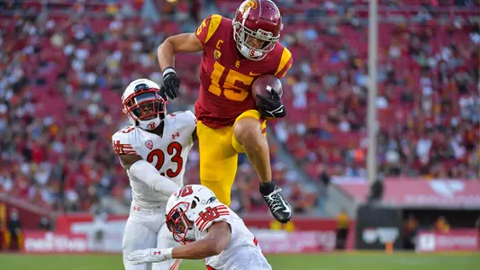 USC Trojans Football wide receiver Drake London hurdles over Utah Utes