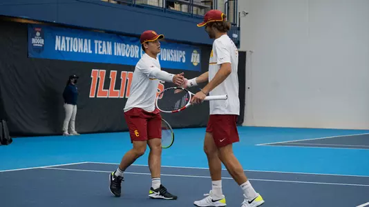Bradley Frye and Stefan Dostanic celebrate a doubles point in Illinois.