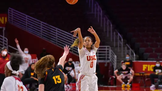 Shalexxus Aaron shoots a three at Galen Center