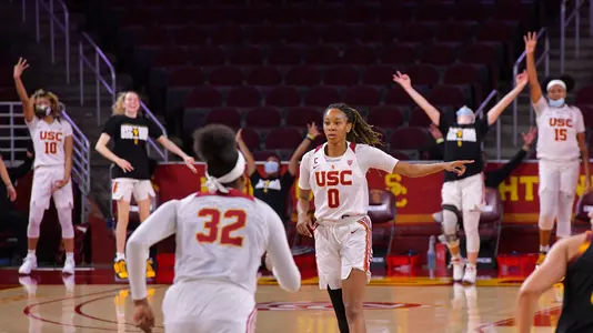 USC celebrates a 3-pointer made by Shalexxus Aaron at Galen Center