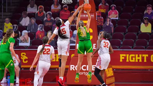 Angel Jackson blocks an Oregon player at Galen Center