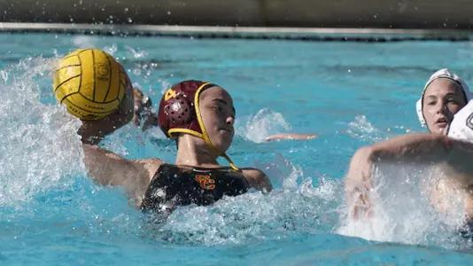 Mireia Guiral turns to shoot out of 2-meters in a win over Michigan in Tempe, Ariz.