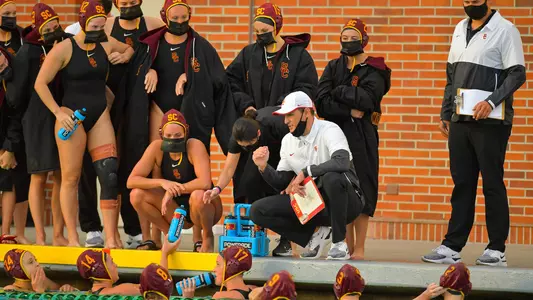 Marko Pintaric talks to the women's team during a home game