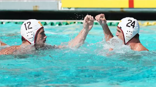 Max Miller and Carson Kranz cheer each other on in the NCAA championship game
