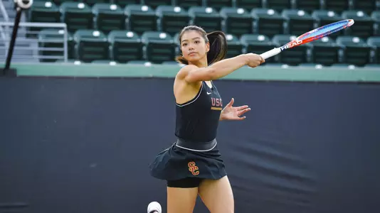 Naomi Cheong swings a forehand shot.