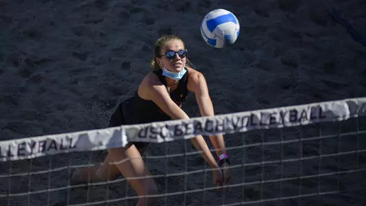 Harper Hallgren digs the ball