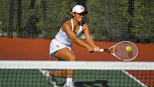 Eryn Cayetano reaches to hit the ball.