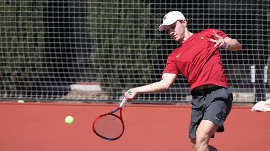 Jake Sands hits a forehand in a match at Marks Stadium