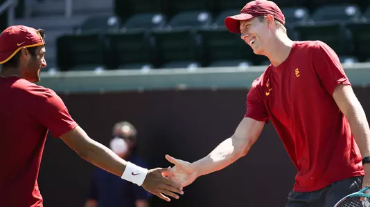Daniel Cukierman and Riley Smith give each other five in a doubles match at Marks Stadium